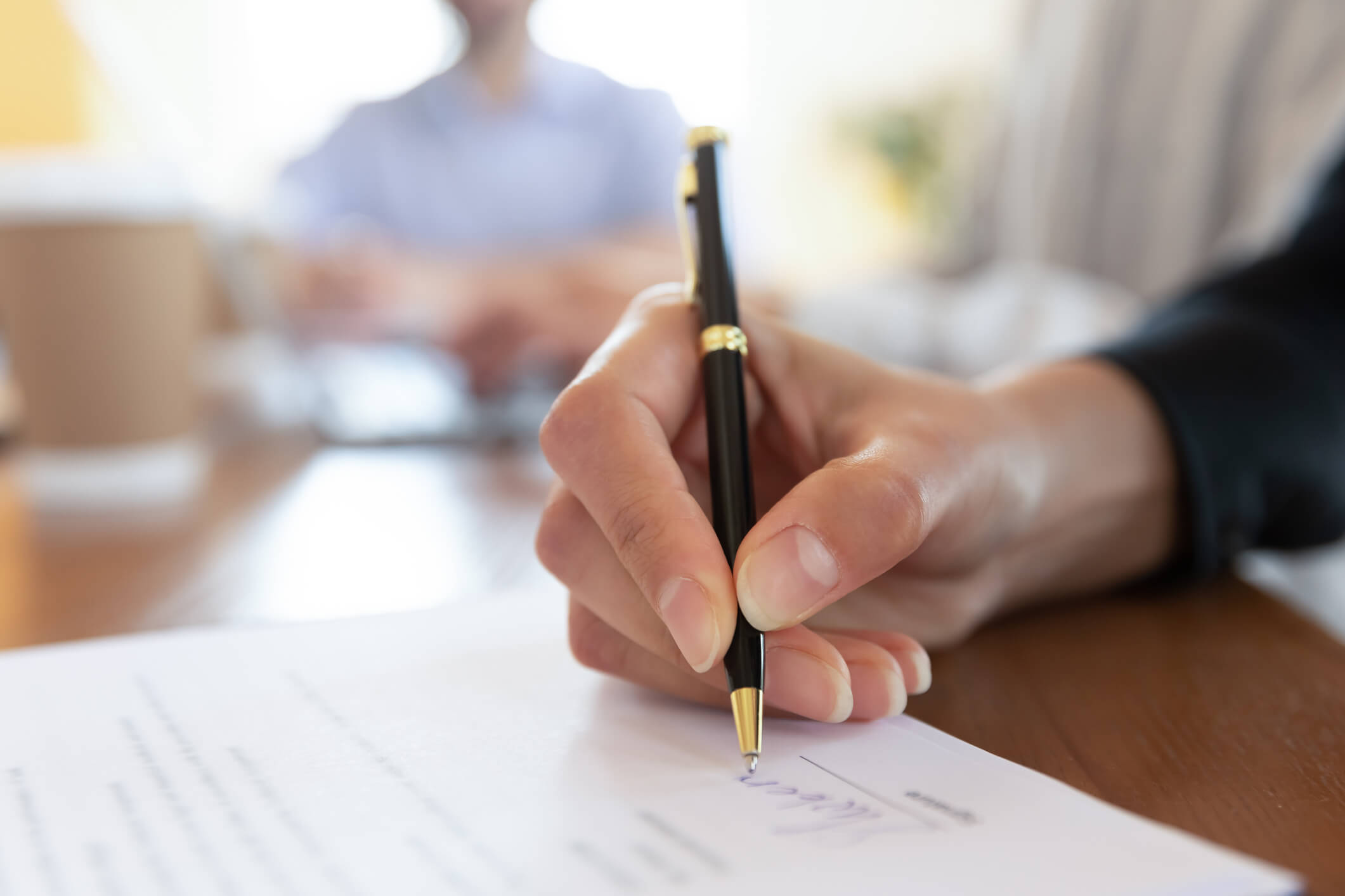 a person signing a dumpster rental franchise agreement