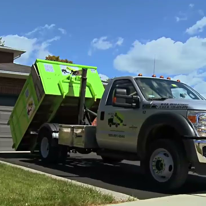 A Bin There Dump That truck drops a bin off in a customer's driveway